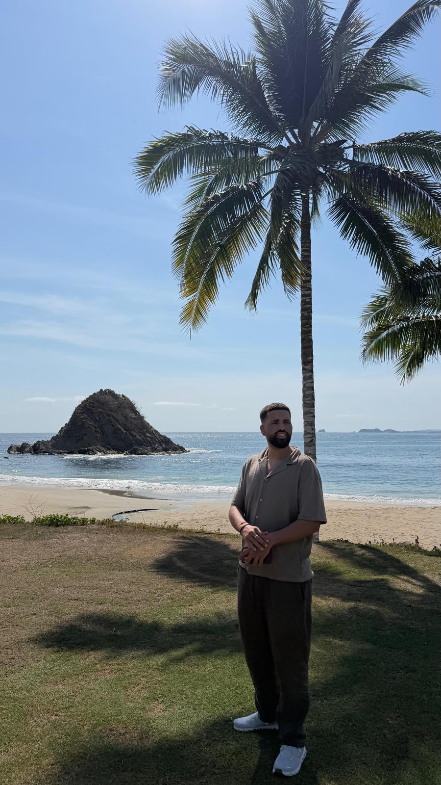 Salah after reaching 181 pounds, standing confidently beside the ocean